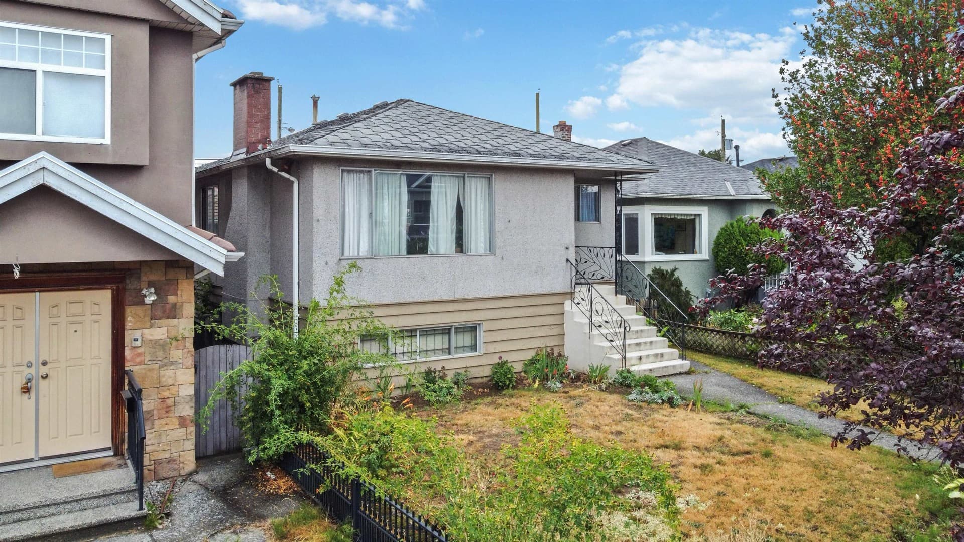 Side exterior — 815 E 56th Avenue
